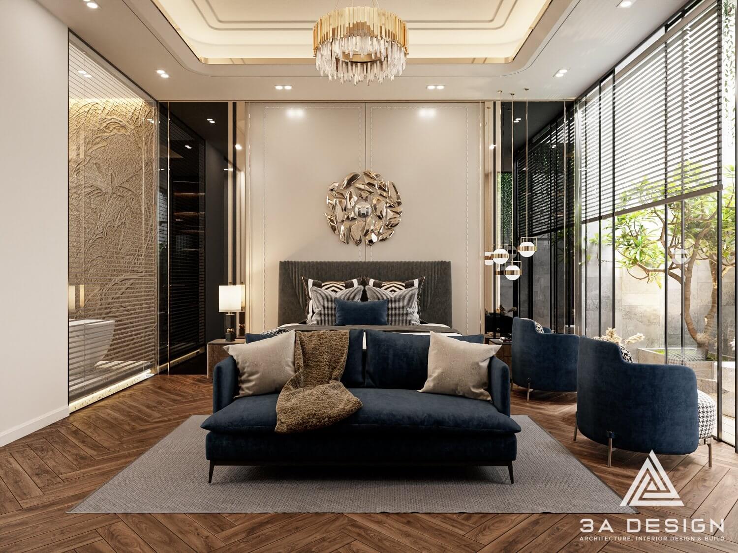Phòng ngủ nổi bật với giường lớn, sofa màu xanh navy, và hệ thống ánh sáng độc đáo.