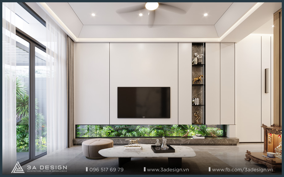 Phòng khách hiện đại với gam màu trung tính, kệ tivi tối giản kết hợp tiểu cảnh xanh tạo điểm nhấn.