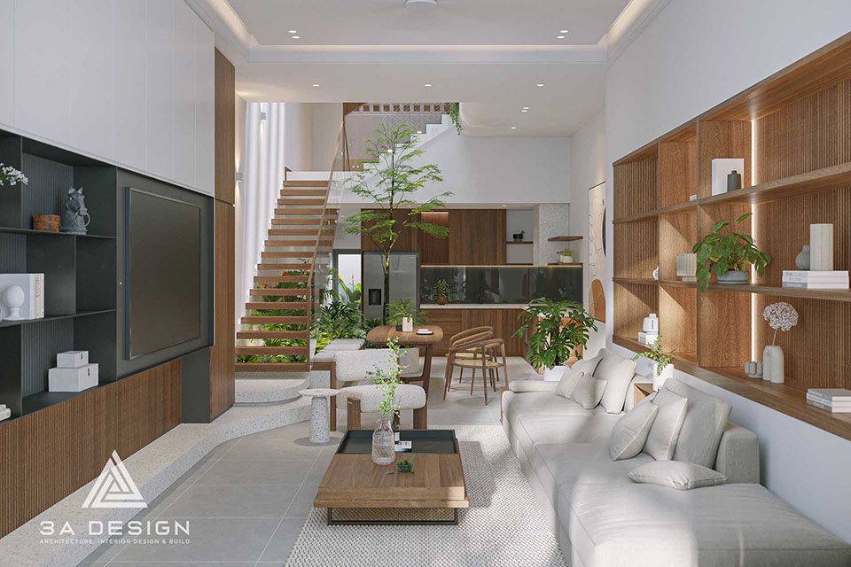 Sự kết nối giữa phòng khách, bàn ăn và bếp dưới ánh sáng trời đổ xuống từ giếng trời trung tâm không chỉ khiến ngôi nhà rộng thoáng mà còn giàu cảm xúc.
