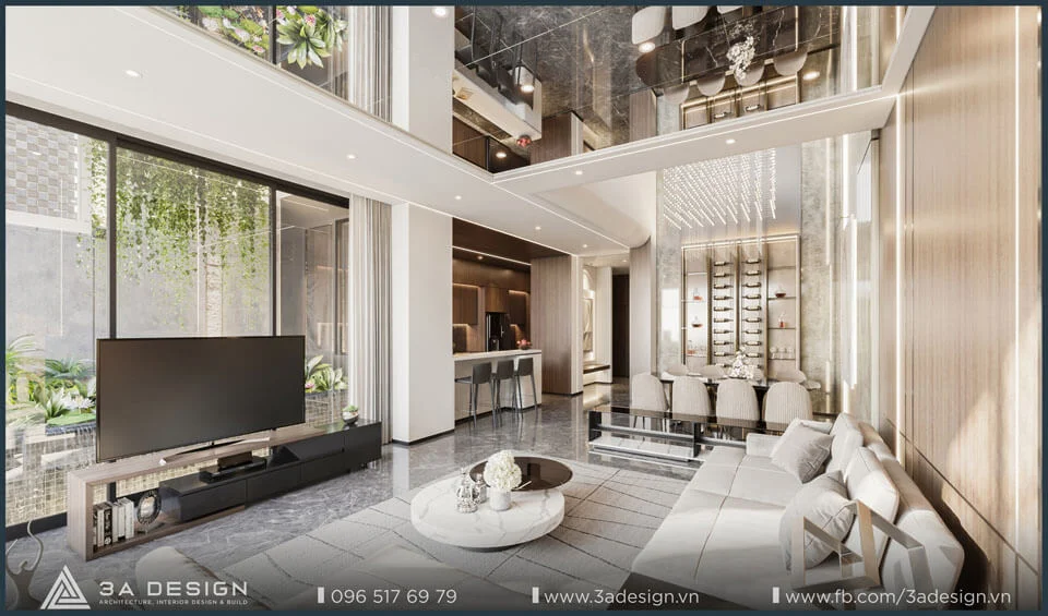 Gương lớn treo đối diện cửa sổ trong phòng khách nhà phố, giúp phản chiếu ánh sáng và tạo cảm giác rộng thoáng hơn.