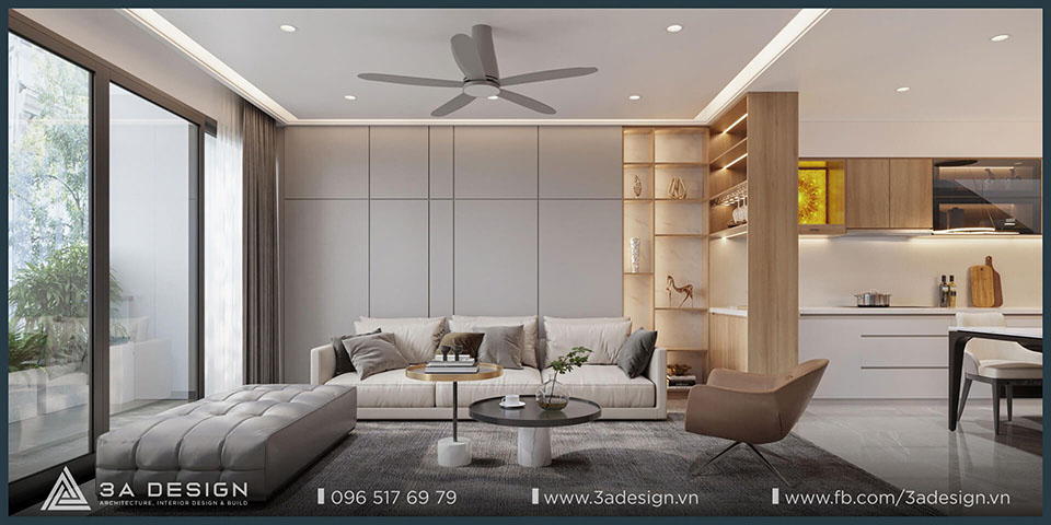 Phòng khách và bếp liên thông trong nhà phố hiện đại với nội thất tối giản, gam màu trắng – be – xám, cửa kính lớn, trần thạch cao và đèn âm trần, thiết kế bởi 3A Design.
