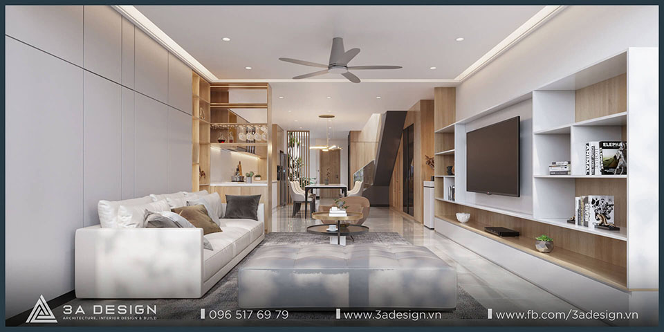 Phòng khách nhà phố hiện đại với gam màu trung tính, nội thất tối giản và ánh sáng tự nhiên tràn ngập, tạo cảm giác sang trọng và thư thái.