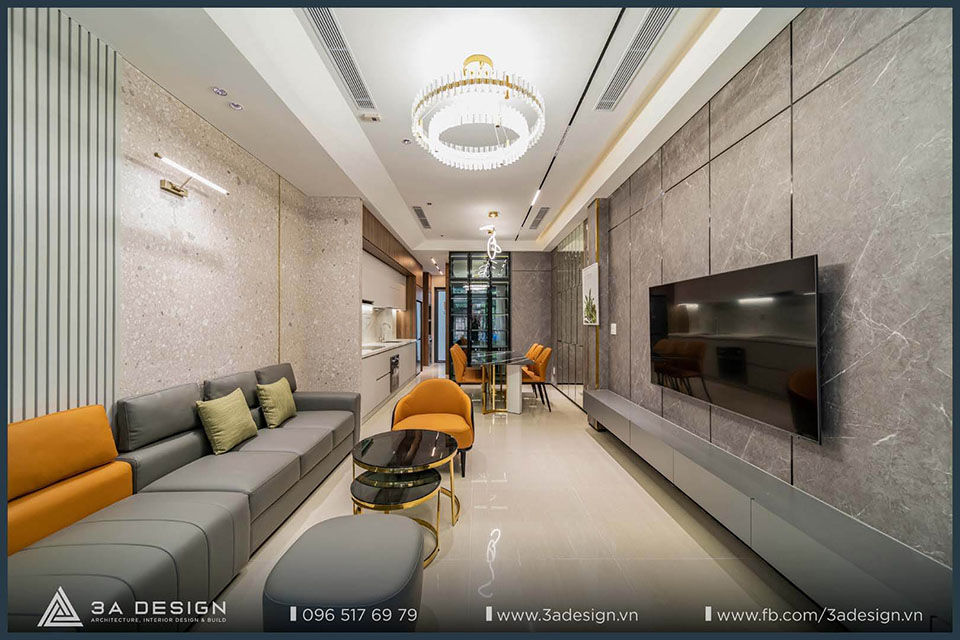 nội thất biệt thự với phòng khách và phòng ăn được thiết kế mở. Không gian nổi bật với đèn chùm pha lê sang trọng, bàn ăn lớn, bộ sofa hiện đại và cửa kính đón ánh sáng tự nhiên.