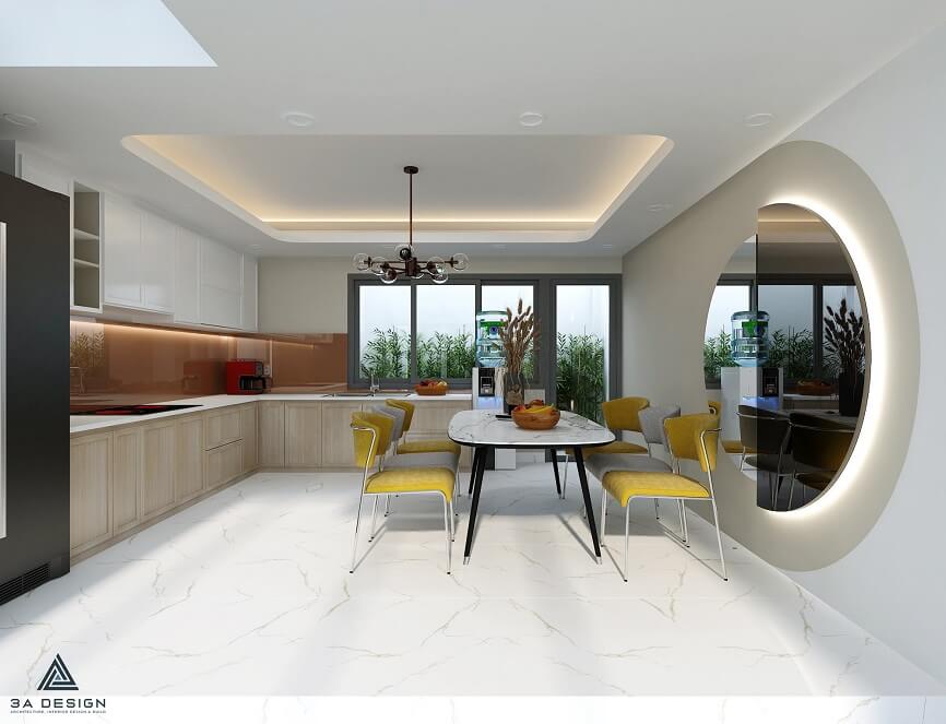 Thiết kế nội thất phòng bếp và bàn ăn hiện đại, sử dụng ánh sáng tự nhiên, gam màu sáng kết hợp điểm nhấn vàng, tạo cảm giác ấm cúng và gắn kết.