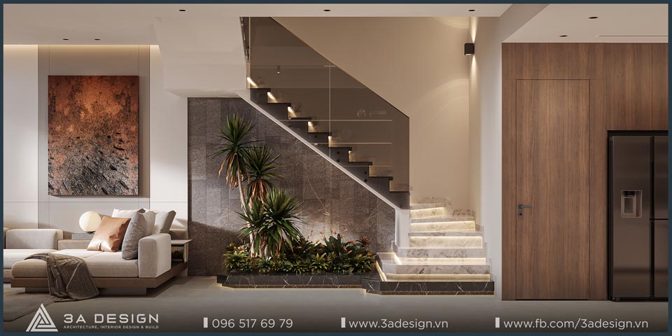 Cầu thang hiện đại lát đá marble kết hợp lan can kính, hệ đèn LED âm cấp và tiểu cảnh cây xanh tạo điểm nhấn thư giãn cho không gian nhà phố.