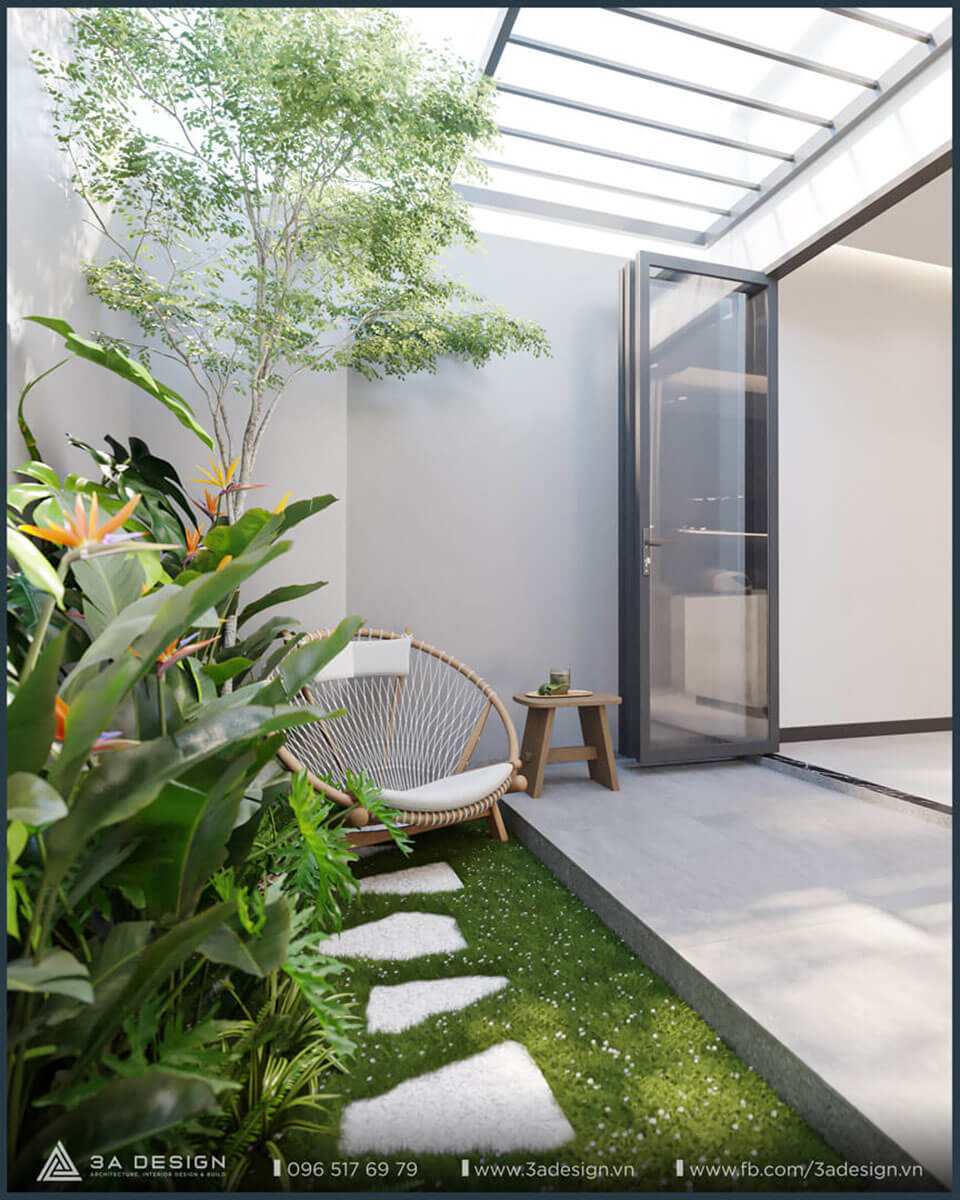 Nội thất bếp và khu vực ăn uống với vách Lam gỗ và mảng xanh, tạo sự riêng tư và hiệu ứng ánh sáng tinh tế.