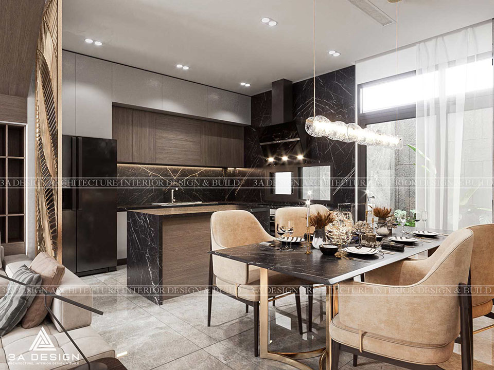 Không gian bếp và phòng ăn hiện đại, sang trọng với tủ bếp gỗ và đá cẩm thạch đen, đi kèm bàn ăn và ghế bọc nệm.