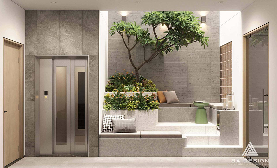 Phòng khách hiện đại với vách sau sofa đa chất liệu và cầu thang nan gỗ, thể hiện xu hướng thiết kế nhà 2026.