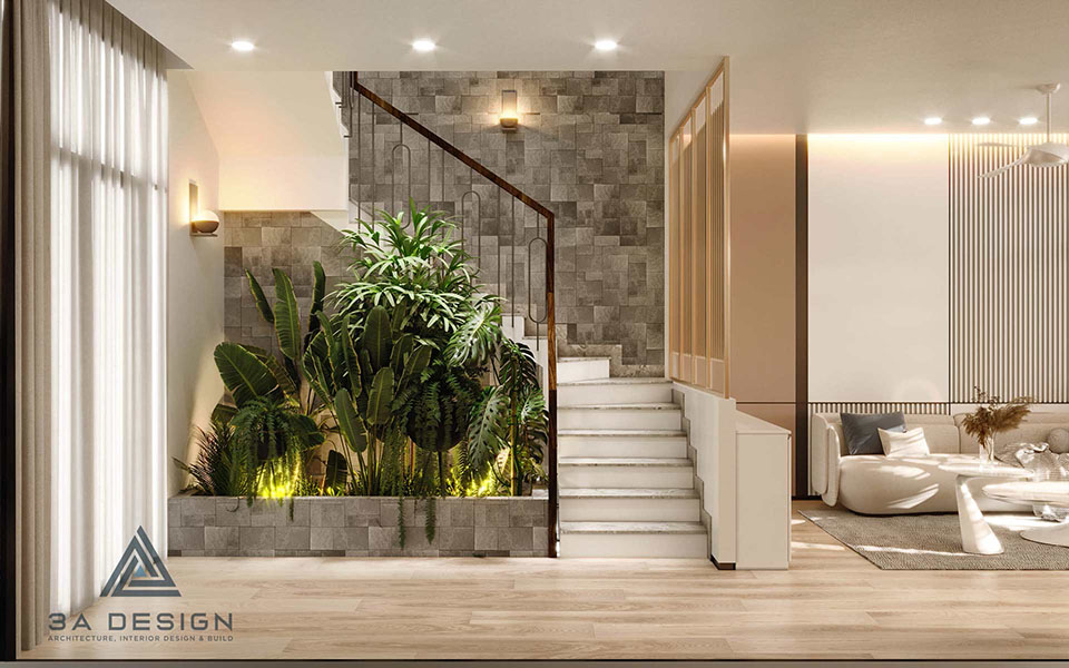 Tiểu cảnh xanh dưới giếng trời bên cạnh cầu thang trong không gian nhà phố hiện đại