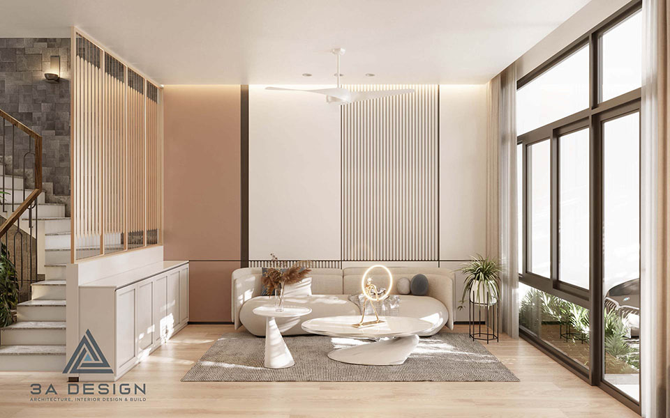 Phòng khách hiện đại với cửa kính trượt khổ lớn, kết nối không gian trong nhà với sân vườn xanh bên ngoài.